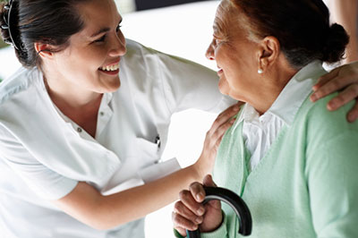 a nurse and a woman looking at the camera